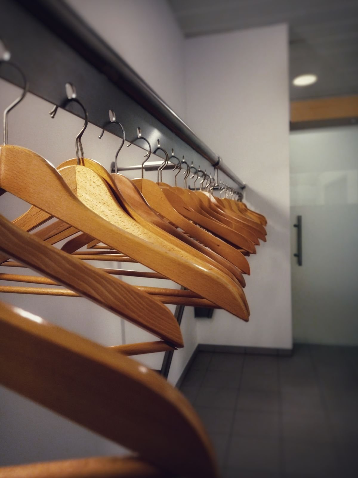 Wooden hangers in wardrobe