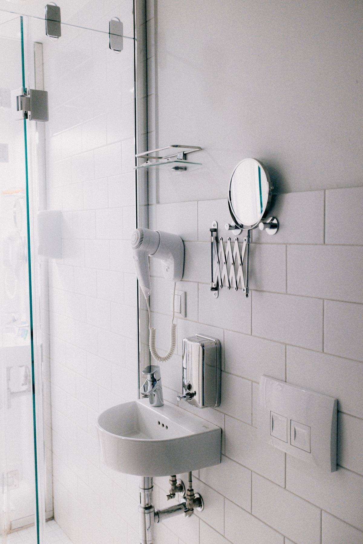 Magnifying mirror in bathroom context