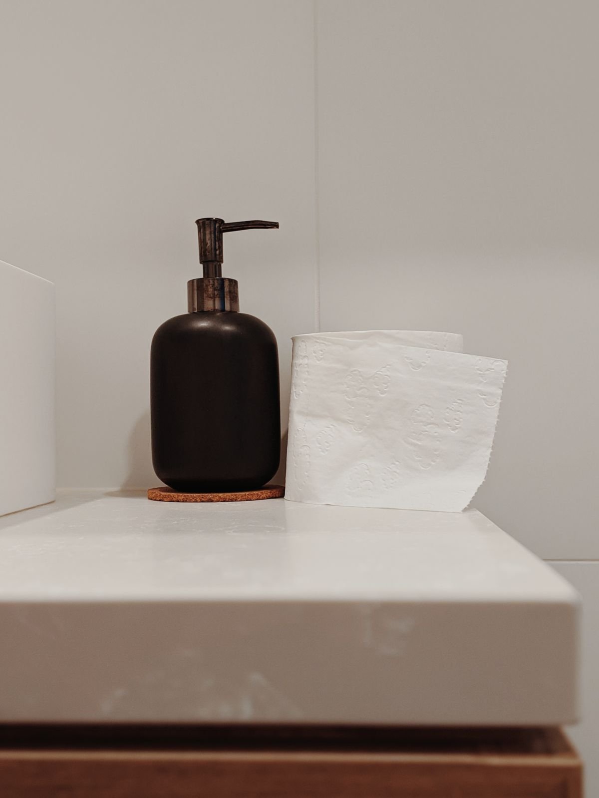 Soap dispenser with tissue