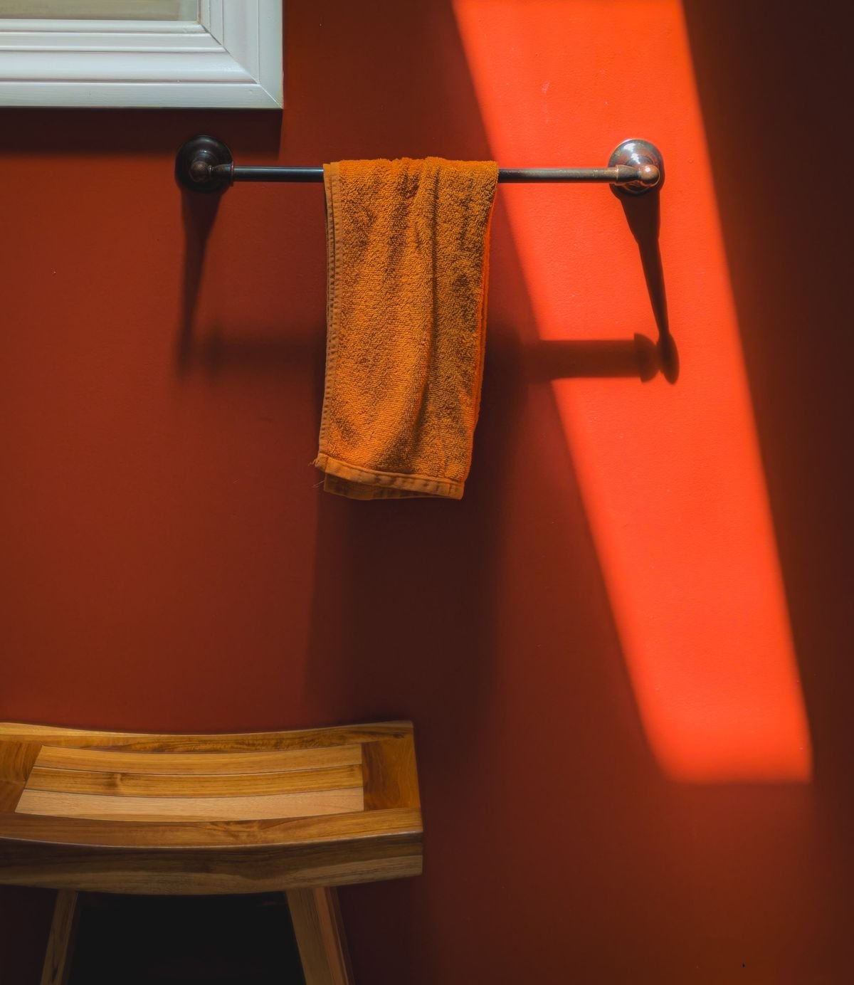 Towel rod on bold wall